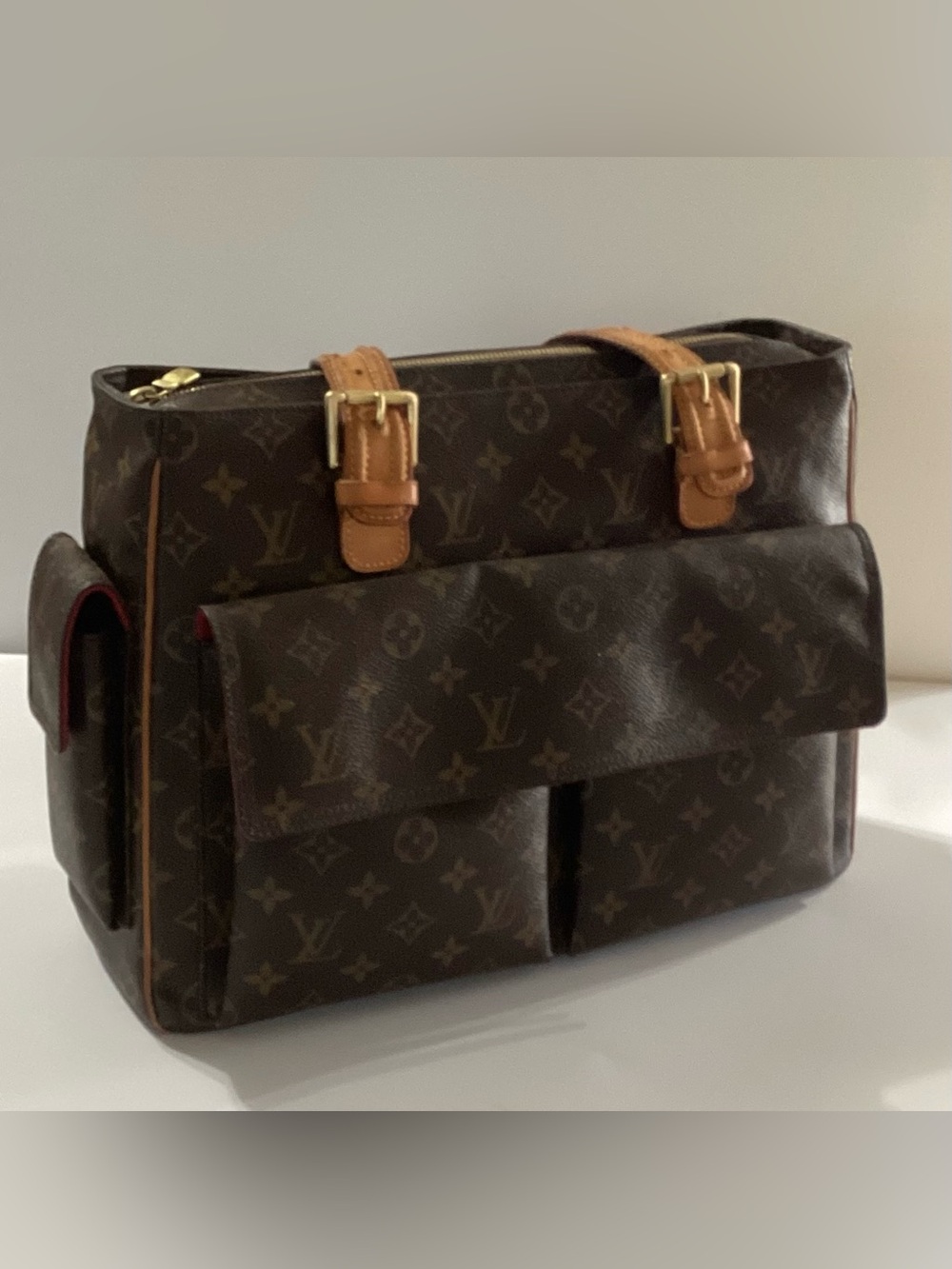 Authentic Louis Vuitton Viva Cite GM Monogram Shoulder Bag.